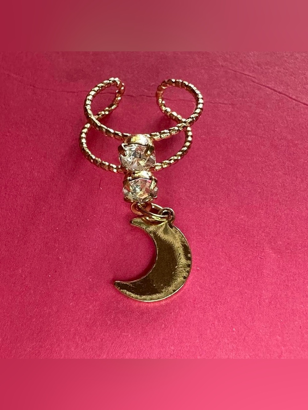 Half moon rhinestone ear cuff.